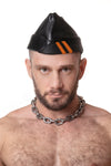 Model wearing black flight cap with orange stripes