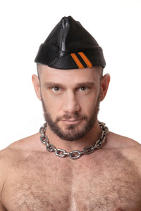 Model wearing black flight cap with orange stripes
