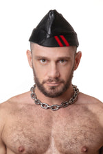Model wearing black flight cap with red stripes