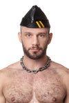 Model wearing black flight cap with yellow stripes