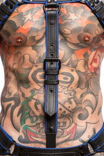 Model wearing a black and blue combat cockstrap. Close up view.