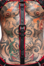 Model wearing a black and red combat cockstrap. Close up view.