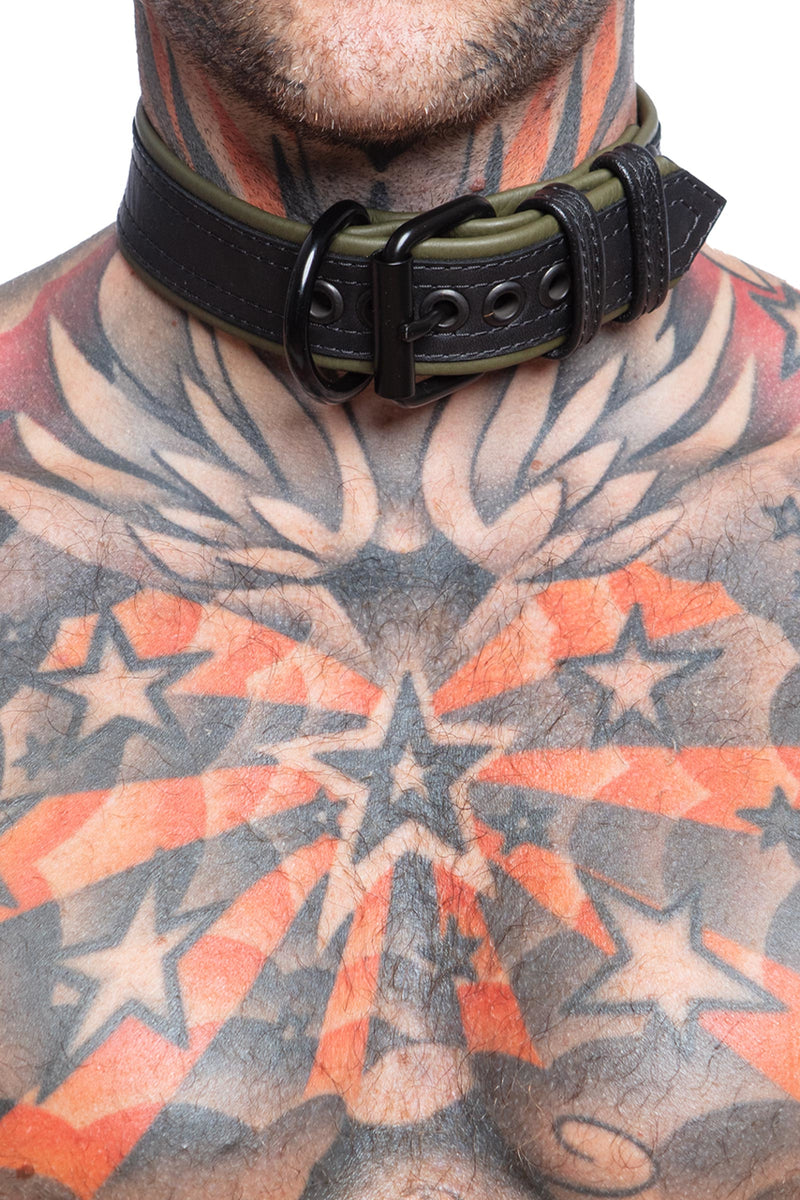 Model wearing a 1.5" black and army green leather pup collar. Close up view.