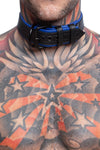 Model wearing a 1.5" black and blue leather pup collar. Close up view.