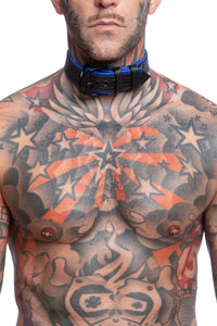 Model wearing a 1.5" black and blue leather pup collar