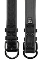 Two 1.5" black and grey leather pup collars with matt black buckles and D-rings
