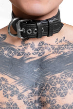 Model wearing 1.5" black leather combat pup collar with stainless steel buckle and hardware