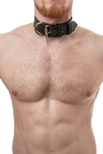 Model wearing black leather pup collar with stainless steel buckle and D-ring