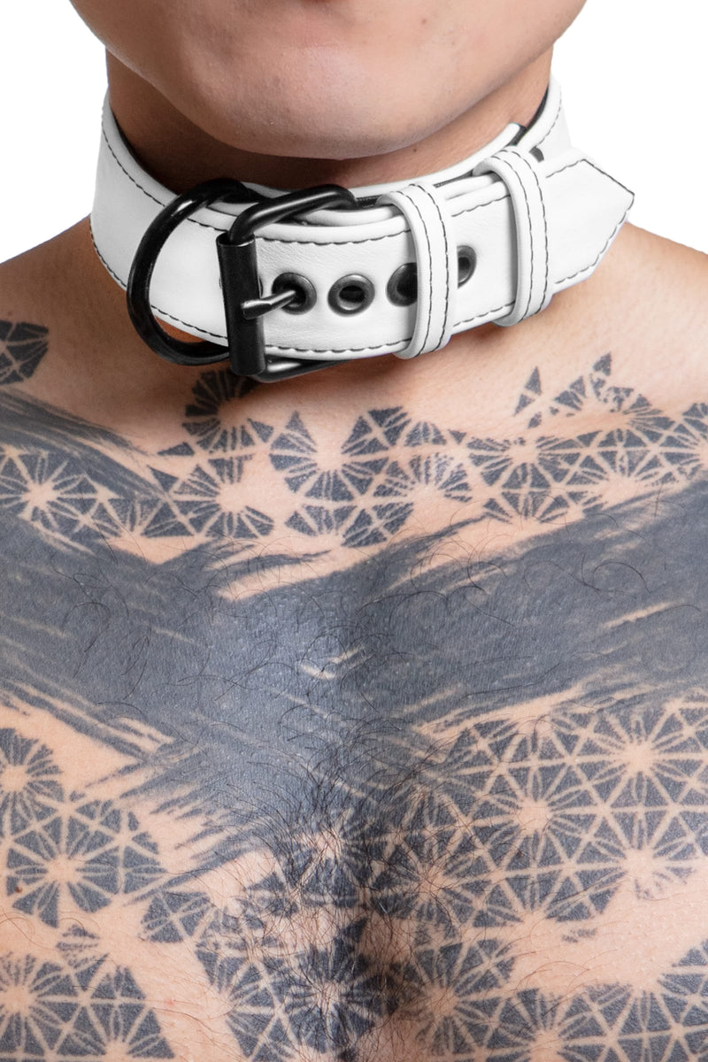 Model wearing 1.5" wide white leather pup collar with matt black buckle and D-ring