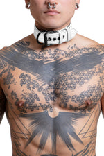 Model wearing 1.5" wide white leather pup collar with matt black buckle and D-ring full body view