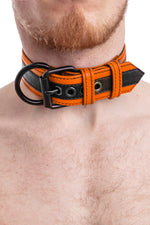 Model wearing black and orange leather racer stripe pup collar