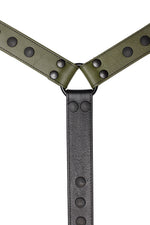 Army green leather bulldog harness connector with black hardware. Close up.
