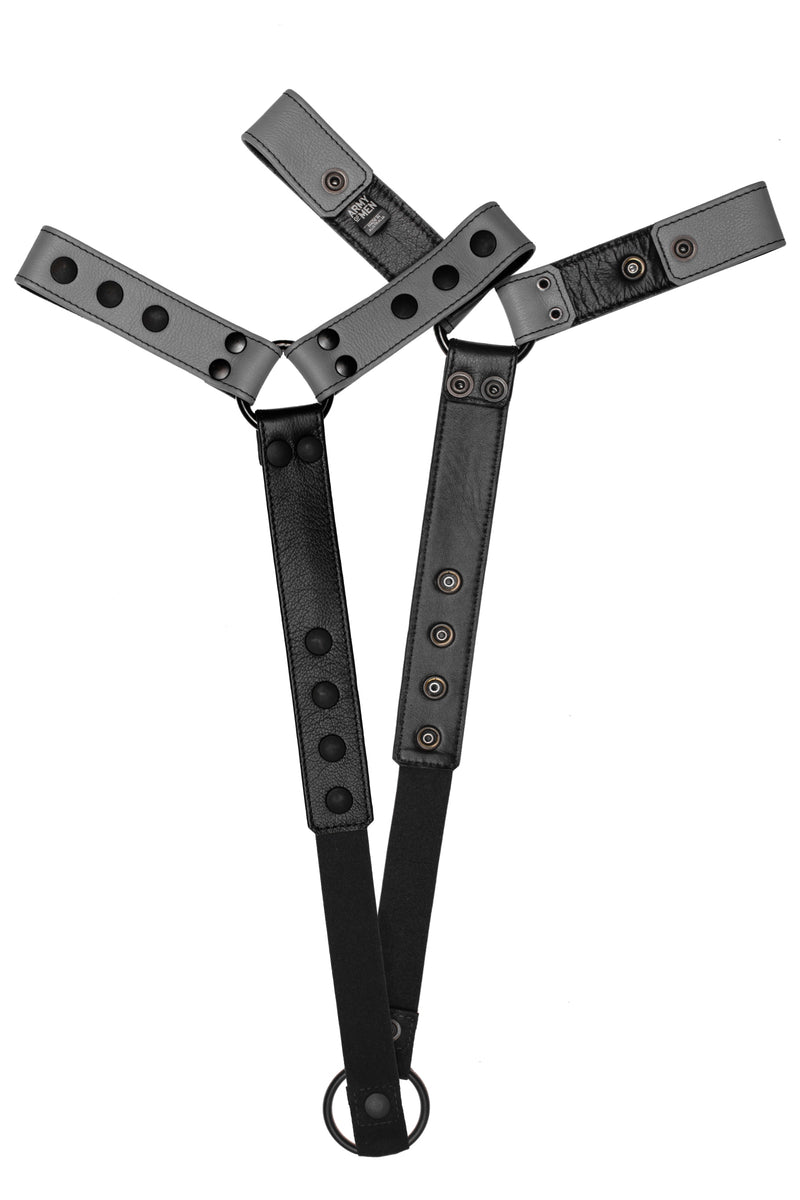 Pair of grey leather bulldog harness connectors with black hardware.