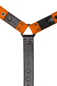 Orange leather bulldog harness connector with black hardware. Lining.