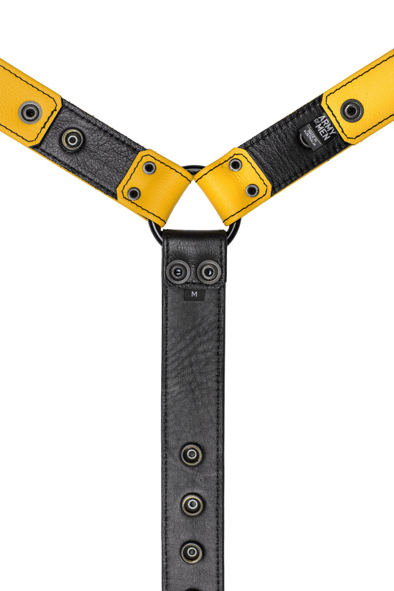 Yellow leather bulldog harness connector with black hardware. Lining.