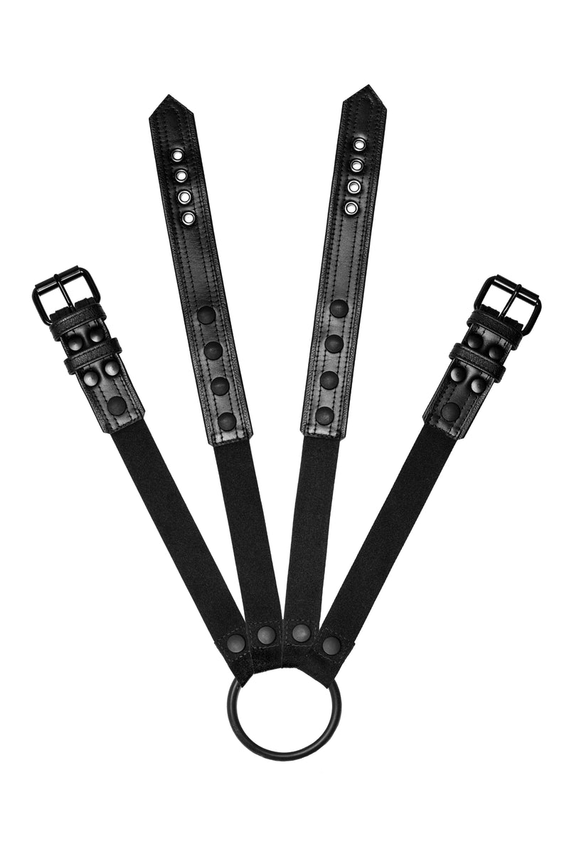 Pair of black leather combat harness connectors with black hardware. Front.