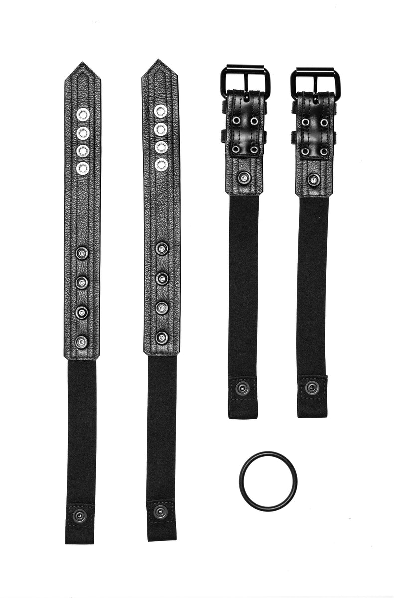 Pair of black leather combat harness connectors with black hardware. Back.