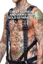Chest harness sold separately. Model wearing a black and blue leather combat harness and connector with black metal hardware. Side view.
