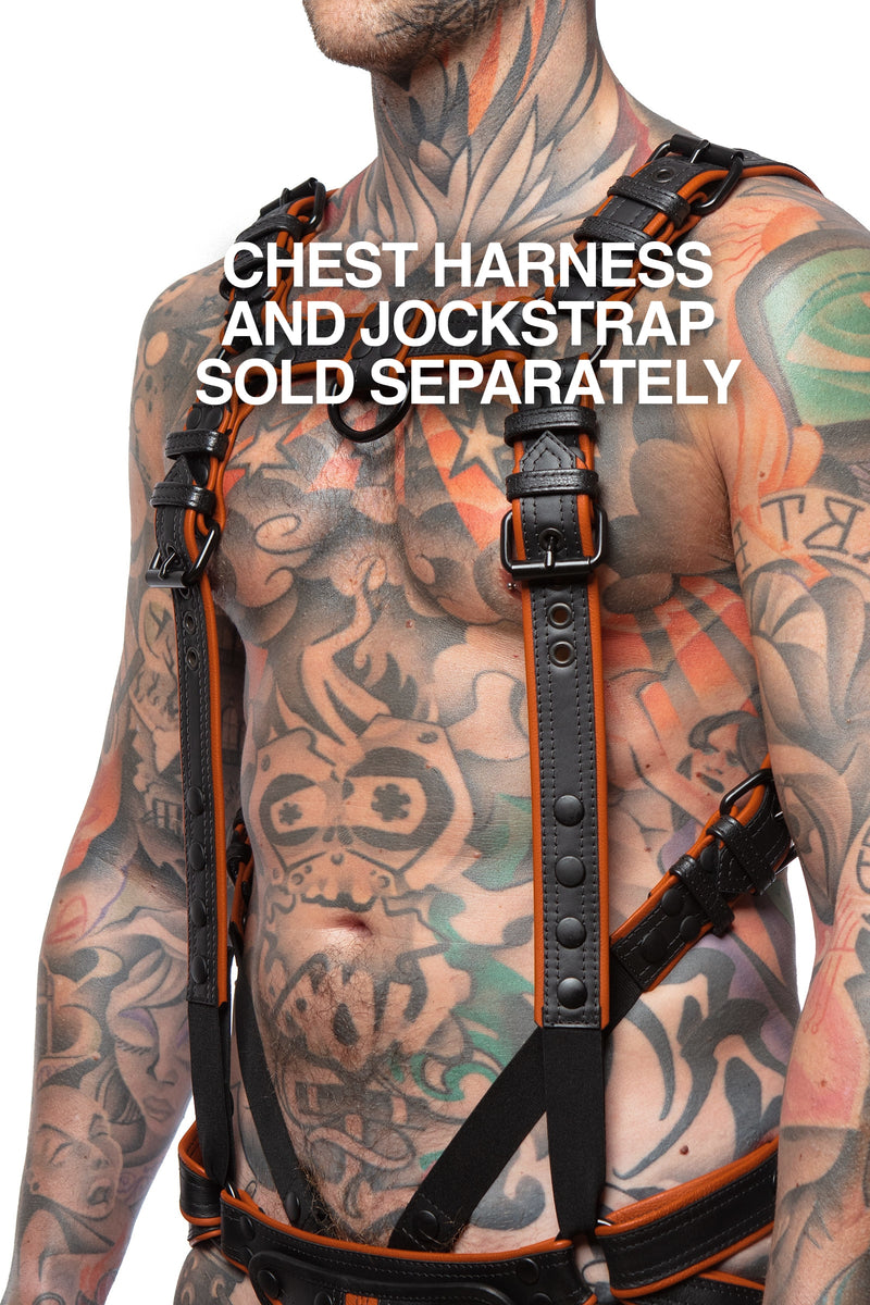 Chest harness sold separately. Model wearing a black and orange leather combat harness and connector with black metal hardware. Side view.