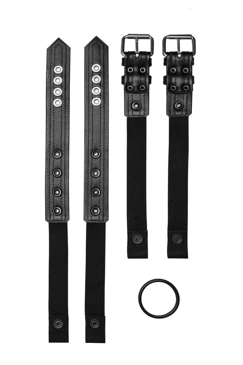 Pair of black leather combat harness connectors with stainless steel hardware. Back view.