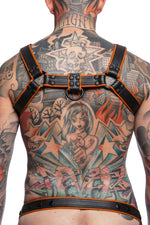 Model wearing black and orange leather combat bulldog harness with matt black metal hardware. Back view.