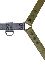 Army green leather bulldog harness with black hardware. Close up.
