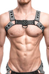 Model wearing a grey leather bulldog harness with black hardware. Front.