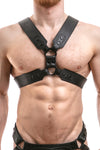 Model wearing a black leather commander harness with matt black hardware
