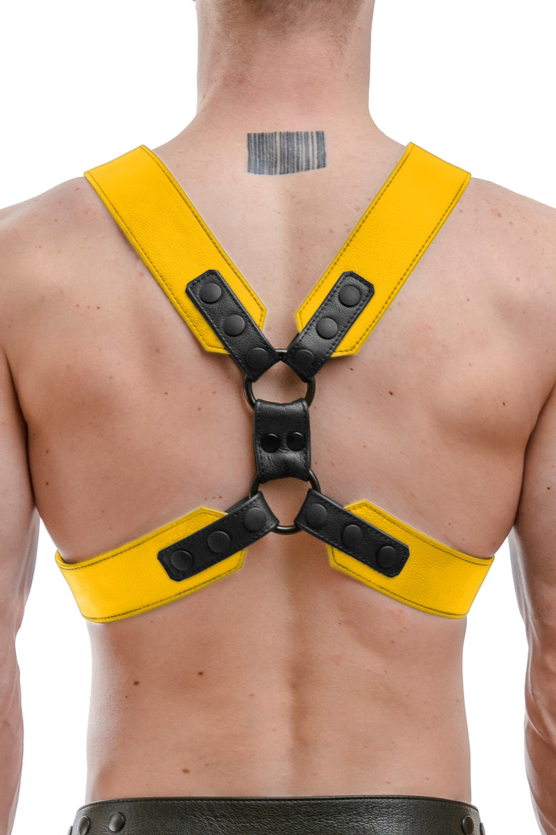 Model wearing a yellow leather commander harness