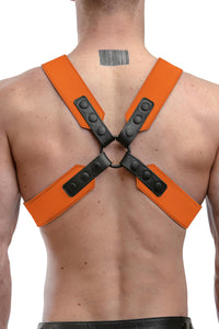 Model wearing an orange leather sergeant harness