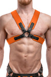 Model wearing an orange leather sergeant harness