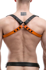 Model wearing orange leather shoulder buckle harness back