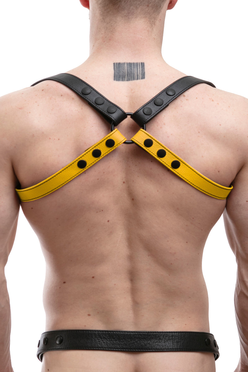 Model wearing yellow leather shoulder buckle harness back