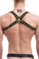 Model wearing army green leather shoulder harness back