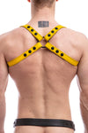 Model wearing yellow leather shoulder harness back