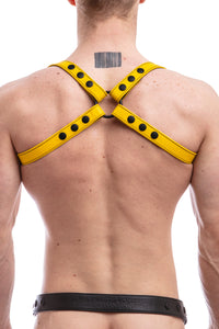 Model wearing yellow leather shoulder harness back