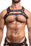 Model wearing black leather universal x harness  with black metal hardware