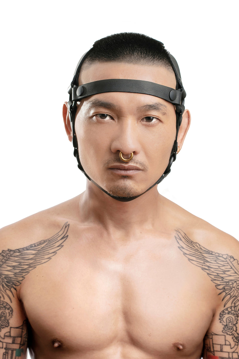 Model wearing black leather head harness front