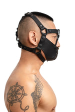 Model wearing black leather head harness and muzzle side