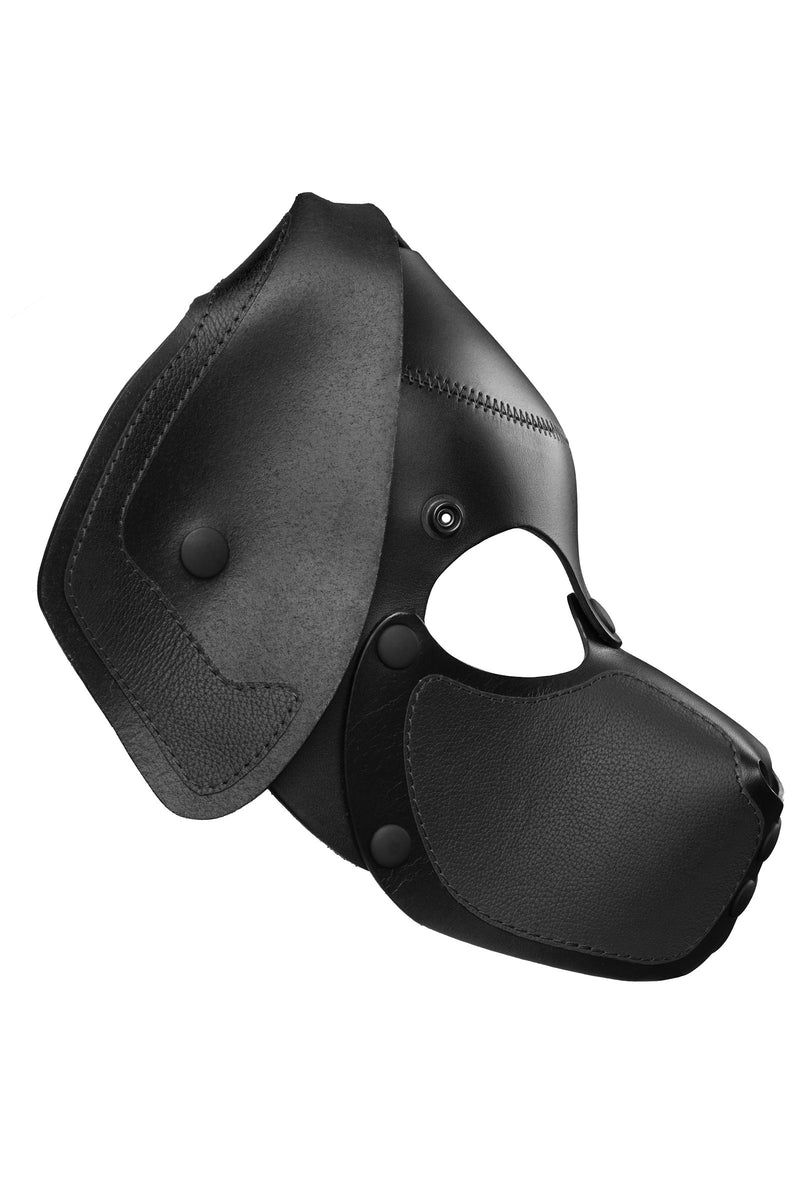 Product photo of a black leather pup mask with floppy ears side view