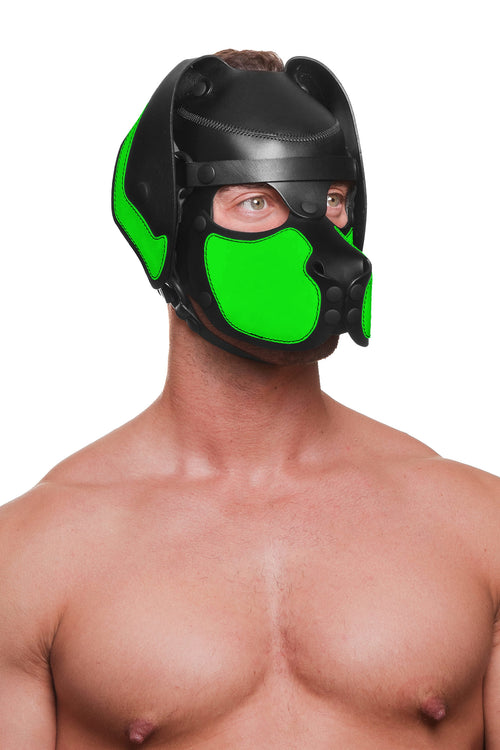 Model wearing a black and fluro green leather pup mask and head harness three quarter view