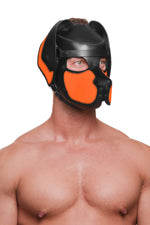 Model wearing a black and fluro orange leather pup mask and head harness three quarter view