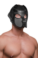 Model wearing a black and grey leather pup mask and head harness three quarter view