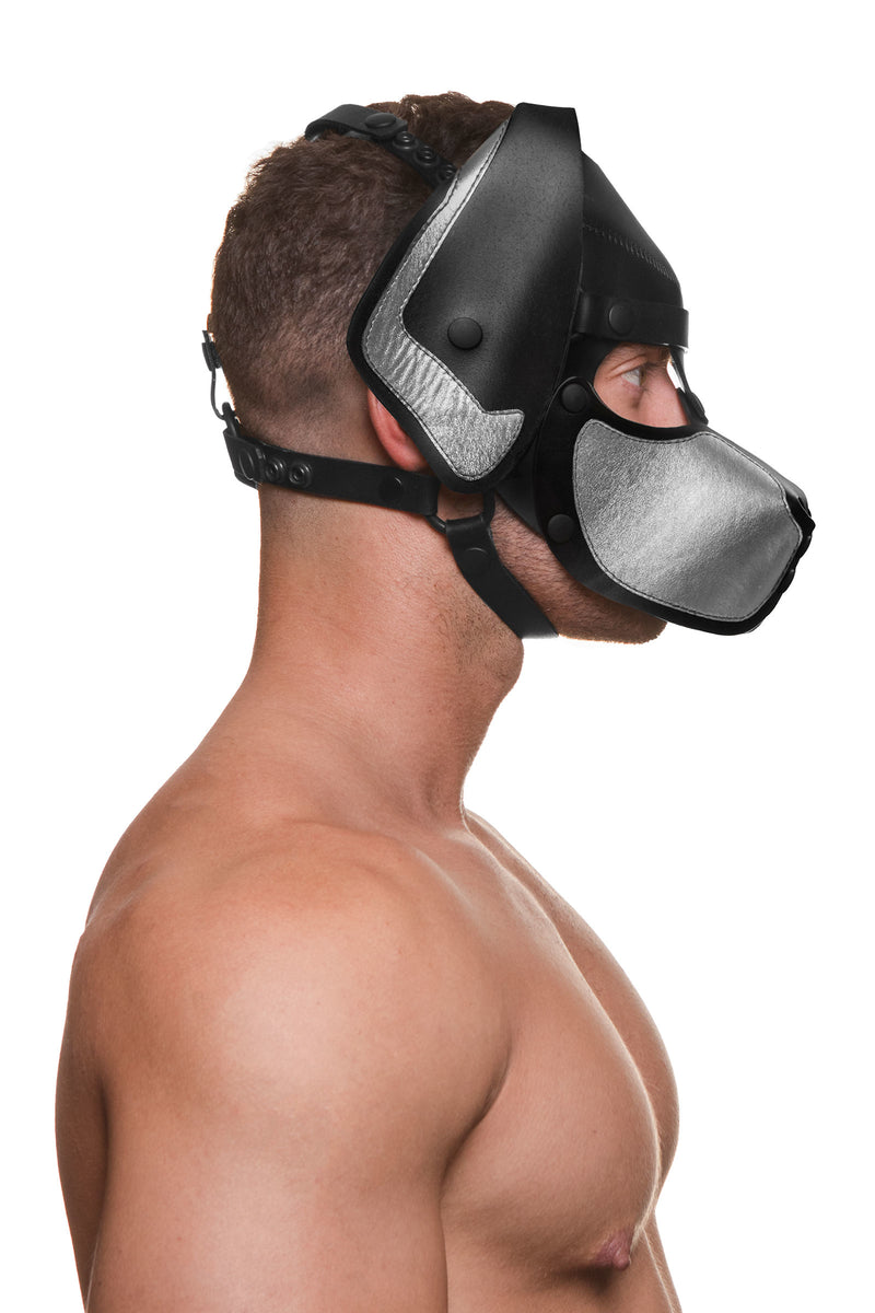 Model wearing a black and metallic silver leather pup mask and head harness side view