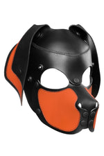 Product photo of a black and orange leather pup mask with floppy ears three quarter view
