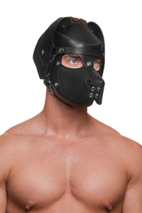 Model wearing a black leather pup mask and head harness with stainless steel hardware three quarter view