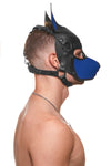 Model wearing a black and blue leather pup mask and head harness side view