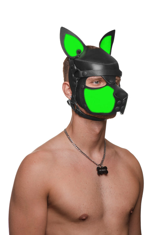 Model wearing a black and fluro green leather pup mask and head harness three quarter view