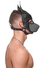 Model wearing a black and grey leather pup mask and head harness side view