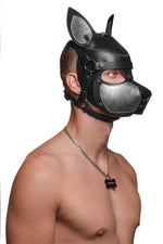 Model wearing a black and metallic silver leather pup mask and head harness three quarter view